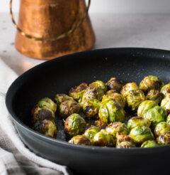 This quick recipe for easy garlic roasted brussels sprouts will make you fall in love with these nutty vegetables. If you ever hated brussel sprouts as a child... these are the ones that will change your mind!