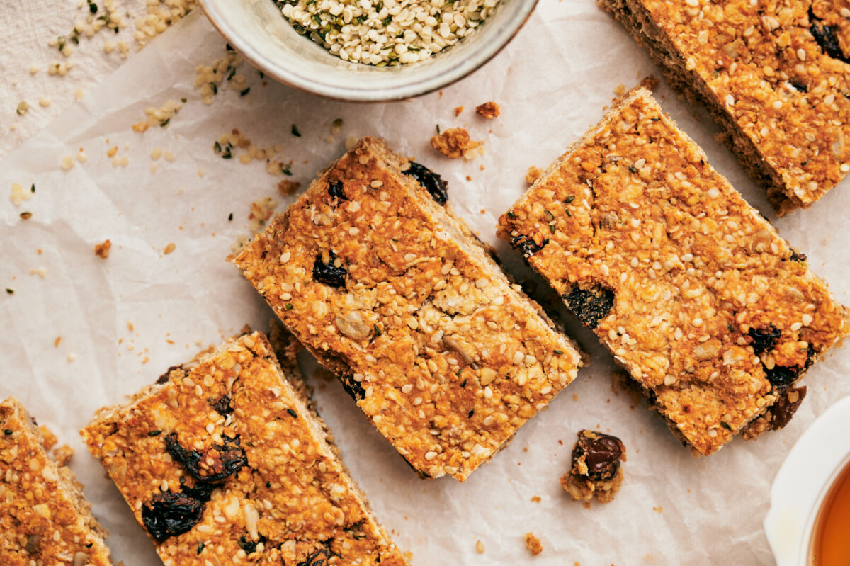 Close-up of homemade granola bars cut up into rectangles.