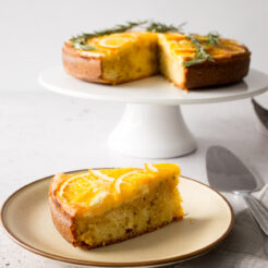 A close-up image of a delicious slice of upside-down orange cake.