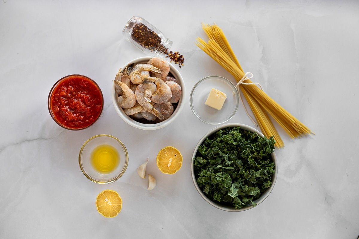 Ingredients for spicy shrimp and kale pasta.